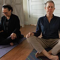 Woman sitting with eyes closed