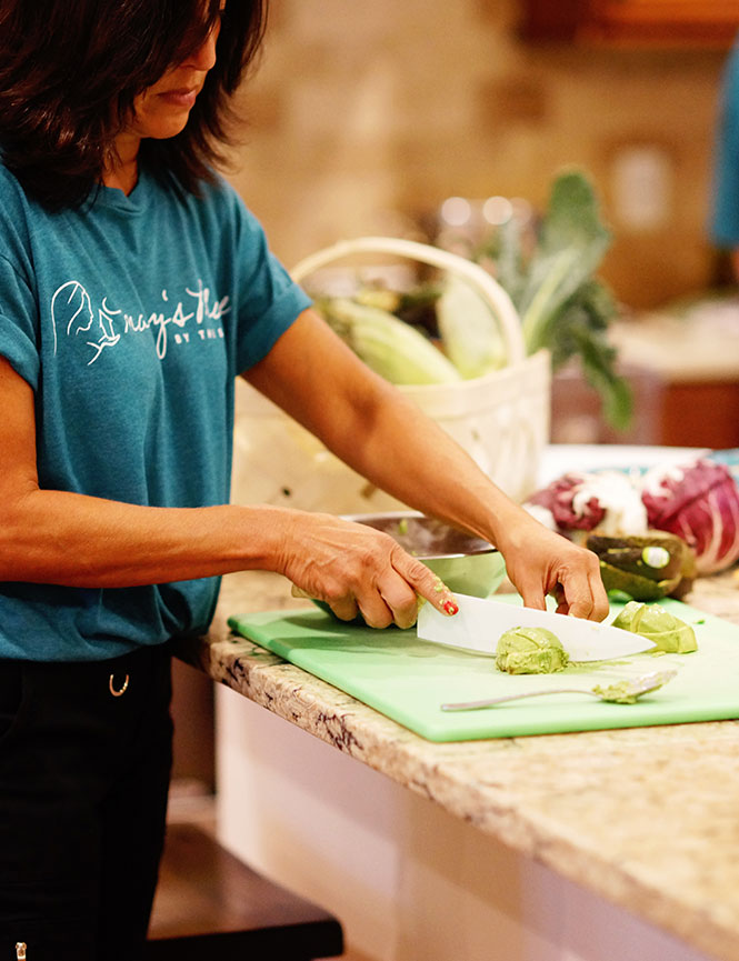 volunteer cutting vegetables