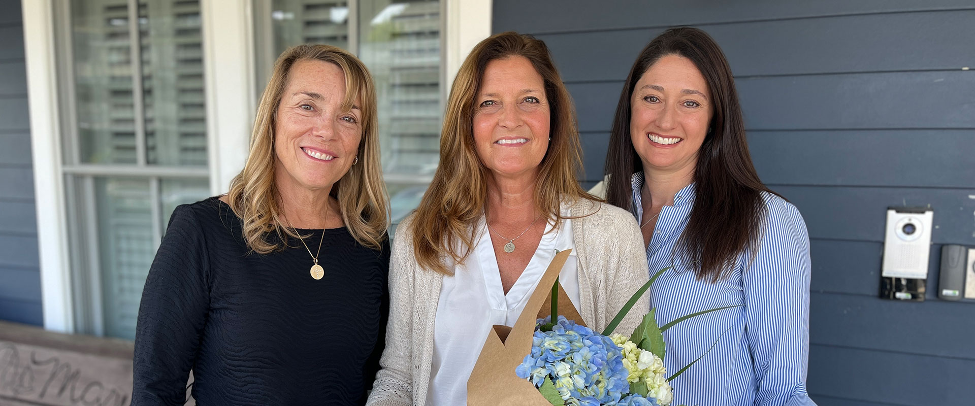 Three women on front porch