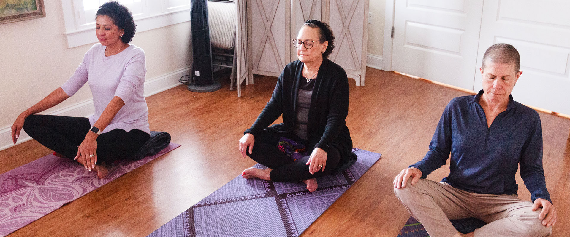 3 women meditating