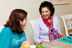 thumbnail of two women sitting to eat